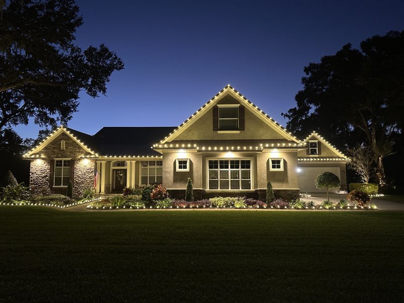 Home in Plant City, FL with warm white Christmas lights along the roofline installed by Exterior Holiday Lights